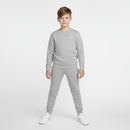 Boy wearing grey Nike sweatpants - square format