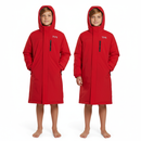 Two young kids wearing matching TYR Hydrosphere Tech Parka in red