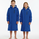 Two young kids wearing matching TYR Hydrosphere Tech Parka with bare legs on white background